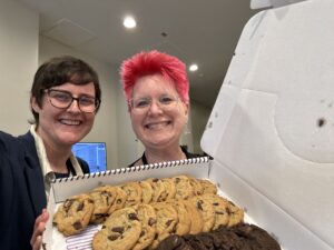 SFWA President Kate Ristau and Rebekah Postupak come bearing cookies for the prep team at this year&#039;s Nebula Awards Conference. (Photo Credit: Kate Ristau, 2025.)