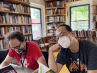 Nebula Award Finalist Benjamin Rosenbaum and SFWA Board Member Curtis Chen enjoy some good lit at a Kansas City bookstore (Prospero&#039;s!) before the Nebula Awards Conference wraps up for another year. (Photo Credit: Kate Ristau, 2025.)