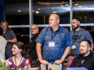 Nebula Conference Panelist William Ledbetter leads the scene in an engaged group of conference attendees. (Photo Credit: Kaitrin Acuna, 2025)