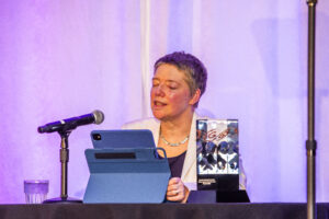 SFWA Grand Master Nicola Griffith delivers her acceptance speech at the 60th Anniversary Nebula Awards Ceremony. (Photo Credit: Kaitrin Acuna, 2025.)
