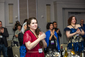 Shannon A. Thompson stands in the foreground of a joyous audience for our Nebula Awards Ceremony on June 7, 2025. (Photo Credit: Kaitrin Acuna, 2025.)