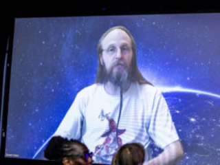 Nebula Award Winner Stewart C. Baker, delivering his part of the team&#039;s acceptance speech online at the 60th Anniversary Nebula Awards Ceremony. (Photo Credit: Kaitrin Acuna, 2025.)