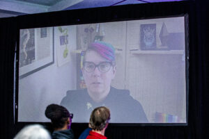 Nebula Award Winner M. Darusha Wehm, delivering their part of the team&#039;s acceptance speech online at the 60th Anniversary Nebula Awards Ceremony. (Photo Credit: Kaitrin Acuna, 2025.)