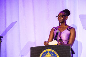 SFWA Executive Director Isis Asare introduces a winner at the Nebula Awards Ceremony held on June 7. (Photo Credit: Kaitrin Acuna, 2025.)