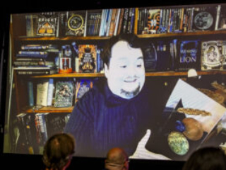 Nebula Award Winner John Wiswell introduces his new award to its &quot;siblings&quot;, joining us online at the 60th Anniversary Nebula Awards Conference. (Photo Credit: Kaitrin Acuna, 2025.)