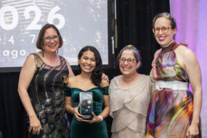 Nebula Finalist Christine Hanolsy, Nebula Winner A. W. Prihandita, , and   celebrate the moment at our 60th Anniversary Nebula Awards Conference. (Photo Credit: Kaitrin Acuna, 2025.)
