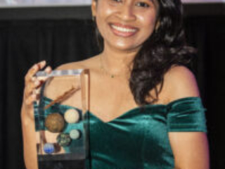 Nebula Award Winner A. W. Prihandita shows off her Nebula Award for Best Novelette. (Photo Credit: Kaitrin Acuna, 2025.)