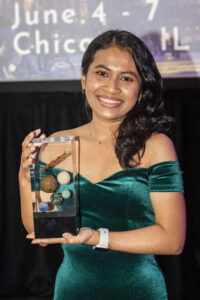 Nebula Award Winner A. W. Prihandita shows off her Nebula Award for Best Novelette. (Photo Credit: Kaitrin Acuna, 2025.)