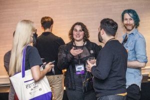 Nebula Finalists Jingjing Xiao, Abby Howard, Tony Howard-Arias, and Paul Dean mingle at our 60th Anniversary Nebula Awards Conference. (Photo Credit: Kaitrin Acuna, 2025.)