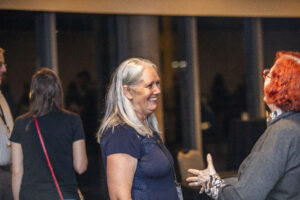 Michelle C. Leigh and Rosemary Claire Smith share a moment of delight at the 60th Anniversary Nebula Awards Conference. (Photo Credit: Kaitrin Acuna, 2025.)
