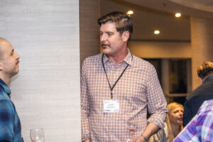 Josh Mendoza mingles at our 60th Anniversary Nebula Awards Conference. (Photo Credit: Kaitrin Acuna, 2025.)