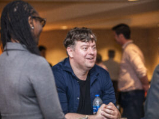 SFWA Executive Director Isis Asare and SFWA Volunteer Nathan Lucas enjoy conversation at our 60th Anniversary Nebula Awards Conference. (Photo Credit: Kaitrin Acuna, 2025.)