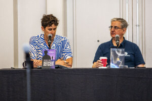 Panelists Michael Solis and Mark D. Owen discussing science fiction at the 60th Anniversary Nebula Awards Conference. (Photo Credit: Kaitrin Acuna, 2025.)