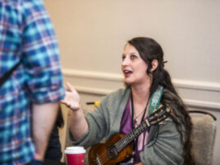 J.H. Fleming carries music into conversation with attendees at our Nebula Awards Conference. (Photo Credit: Kaitrin Acuna, 2025.)