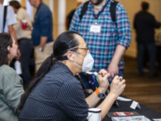 Author and SFWA Board Member Curtis Chen regales attendees at our Nebula Awards Conference. (Photo Credit: Kaitrin Acuna, 2025.)
