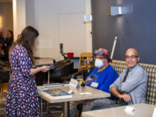 Steven D. Brewer&#039;s table draws attention at a Meet &amp; Greet session during our 60th Anniversary Nebula Awards Conference. (Photo Credit: Kaitrin Acuna, 2025.)