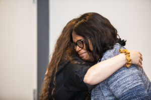 A big hug for a wonderful SFWA Board Member, Christine Taylor-Butler, at our 60th Anniversary Nebula Awards Conference. (Photo Credit: Kaitrin Acuna, 2025.)