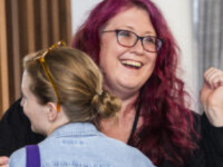 Joy abounds! Karen Osborne at the 60th Anniversary Nebula Awards Conference. (Photo Credit: Kaitrin Acuna, 2025.)