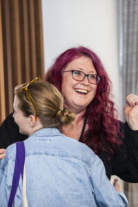 Joy abounds! Karen Osborne at the 60th Anniversary Nebula Awards Conference. (Photo Credit: Kaitrin Acuna, 2025.)