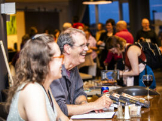 Joy shared between networking authors, including R. R. Corvi. (Photo Credit: Kaitrin Acuna, 2025.)