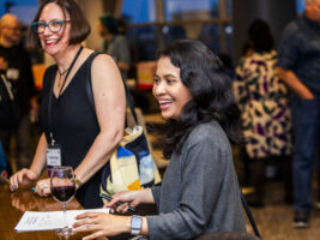 Nebula Award Finalist Christine Hanolsy and Nebula Award Winner A. W. Prihandita enjoying the mass autograph session at our 60th Anniversary Nebula Awards Conference (Photo Credit: Kaitrin Acuna)