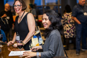 Nebula Award Finalist Christine Hanolsy and Nebula Award Winner A. W. Prihandita enjoying the mass autograph session at our 60th Anniversary Nebula Awards Conference (Photo Credit: Kaitrin Acuna)
