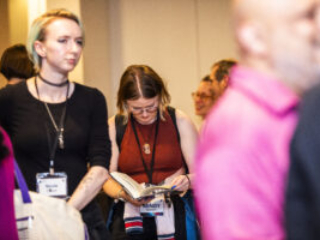 Nebula Awards Conference attendee Mindy Bowen, enjoying a book at the event. (Photo Credit: Kaitrin Acuna)