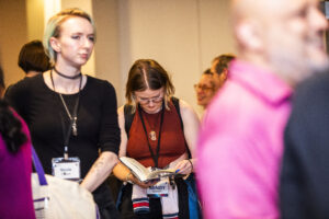Nebula Awards Conference attendee Mindy Bowen, enjoying a book at the event. (Photo Credit: Kaitrin Acuna)