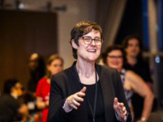 SFWA President Kate Ristau, speaking in a happy crowd