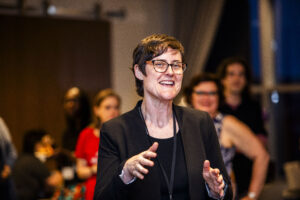 SFWA President Kate Ristau, speaking in a happy crowd