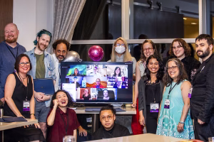 60th Nebulas - Finalist Photo In-person, from left to right: Ray Nayler, Christine Hanolsy, Paul Dean, Benjamin Rosenbaum, Pinki Li, Remy Siu, Jingjing Xiao, Aimee Ogden, A.W. Prihandita, Jennifer Hudak, Abby Howard, Tony Howard-Arias On-screen, left to right: Row 1 - Angela Liu, Darusha Wehm, Isabel J. Kim; Row 2 - Jordan Kurella, José Pablo Iriarte, Kate Heartfield; Row 3 - Sofia Samatar, Vanessa Ricci-Thode. (Photo Credit: Kaitrin Acuna, 2025.)